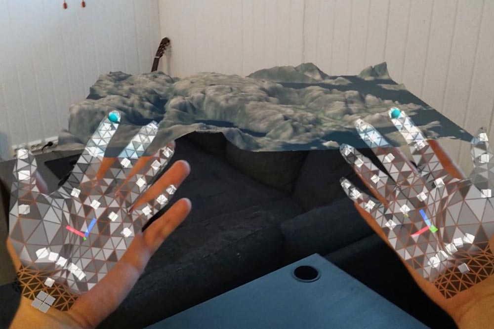 Image showing a pair hands overlayed with augmented reality graphics.