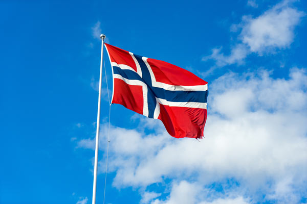 The flag of Norway, with blue sky in the background.